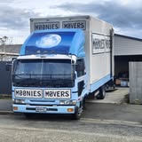 Moonies Movers blue Nissan truck front view